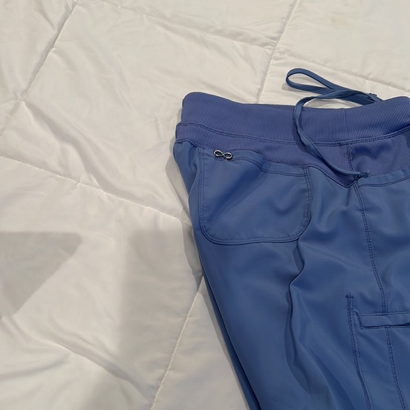 Pair of ceil blue scrubs, medium top and large bottom. See pictures for flaws. - Picture 8 of 11